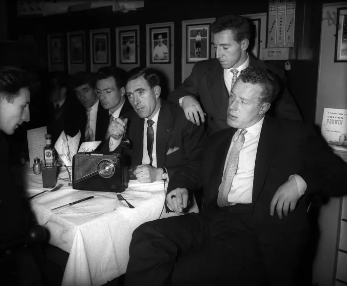 Framed Print : Johnny Brooks and other Tottenham Hotspur players sitting around table listening to Framed Print : Johnny Brooks and other Tottenham Hotspur players sitting around table listening to
