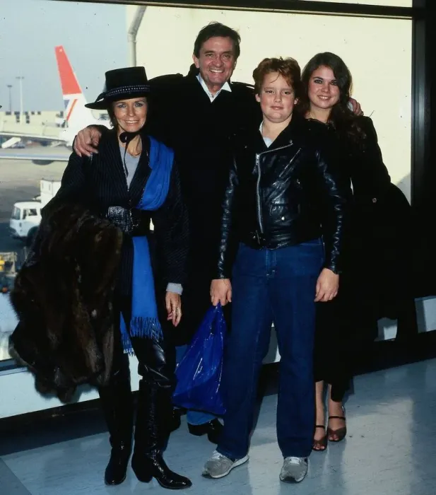 Framed Print : Johnny Cash with family at airport April 1984