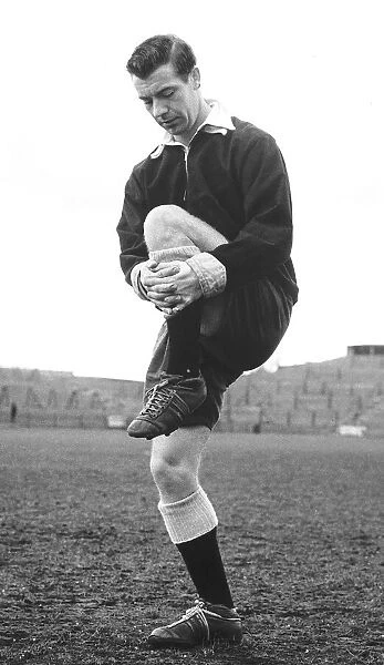 Johnny Haynes footballer captain of Fulham and England limbering up at Craven Cottage