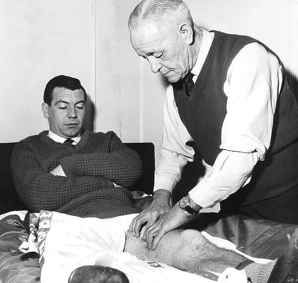 Johnny Haynes footballer and captain of Fulham and England receiving treatment from Frank