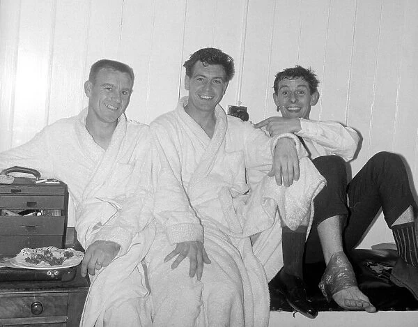 Johnny Haynes of Fulham in the dressing room with comedian Tommy Trinder after the league