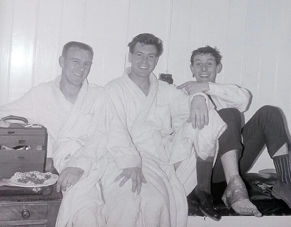 Johnny Haynes of Fulham in the dressing room with comedian Tommy Trinder after the league