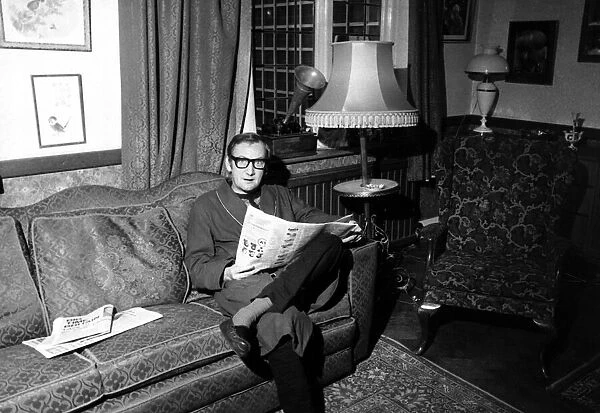 Johnny Speight TV Srcipt Writer - portrait sitting on a sofa  /  couch reading a newspaper