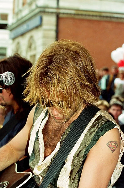 Jon Bon Jovi, lead singer of rock group Bon Jovi, busking in Covent Garden