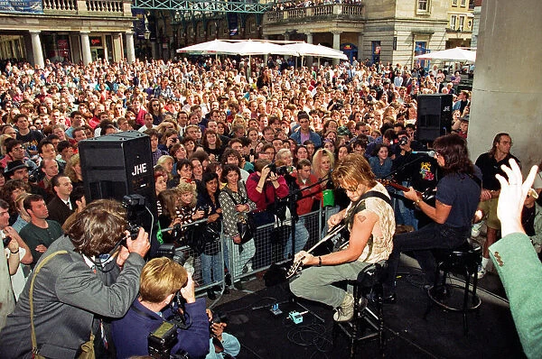 Jon Bon Jovi, lead singer of rock group Bon Jovi, busking in Covent Garden