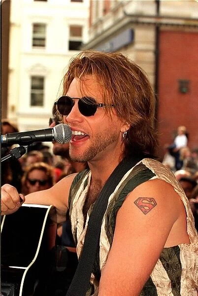 Jon Bon Jovi pop star busking in Covent Garden crowds Playing the guitar
