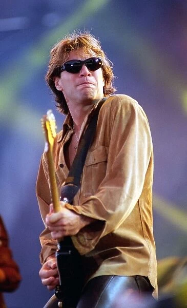 Jon Bon Jovi on stage at Ibrox playing guitar 1996