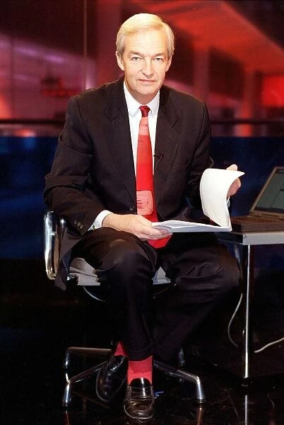 Jon Snow TV Presenter December 1998 Cahnnel 4 newscaster sitting on his pushbike