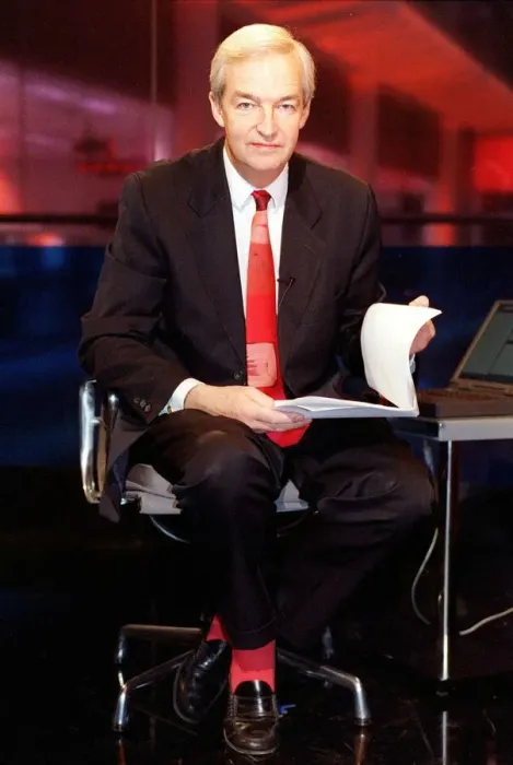 Framed Print : Jon Snow TV Presenter December 1998 Cahnnel 4 newscaster sitting on his pushbike