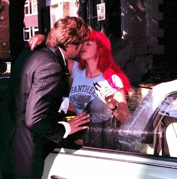 Jonathan Ross TV Presenter June 1999 and wife Jane Ross kissing