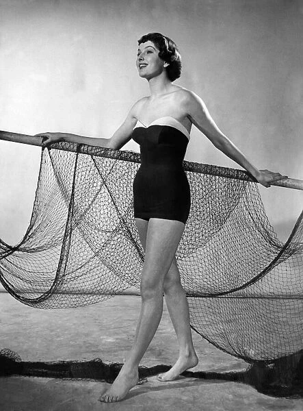 Jontzens sleek one-piece Nylon swimsuit shows the 1951 trend for the sea shore