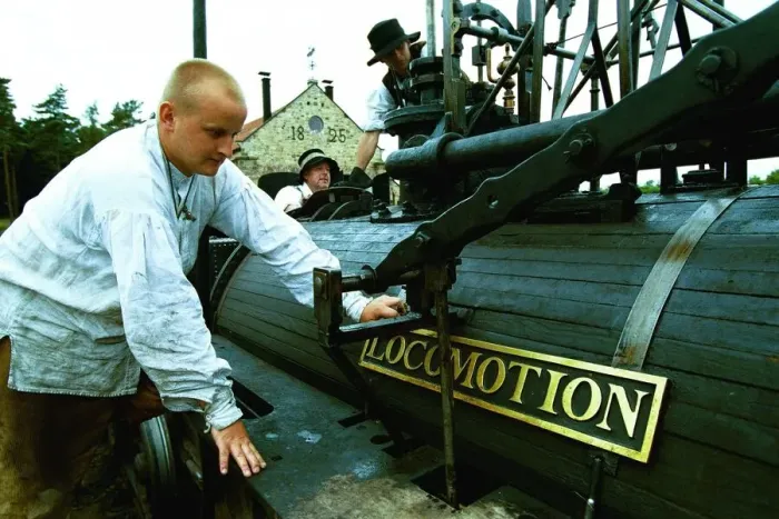 Framed Print : Joseph Welsh polishes the replica Locomotion No. 1 name plate at Beamish Museum