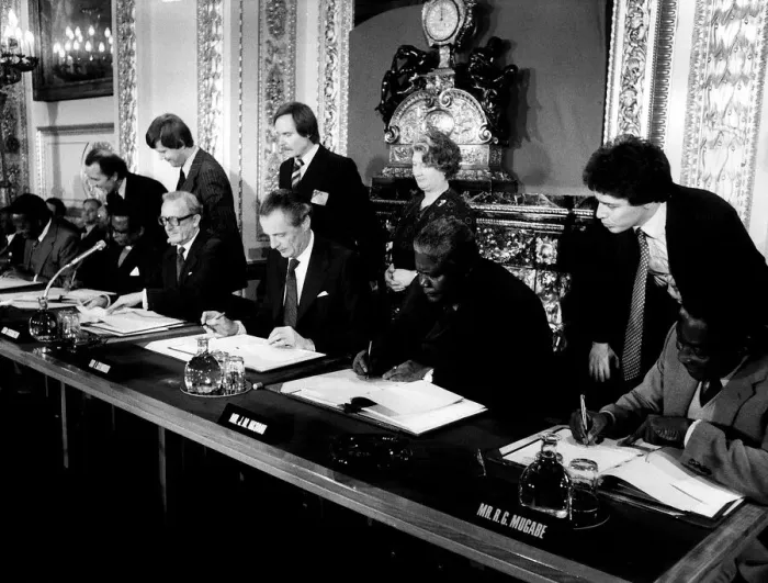 Framed Print : Joshua Nkomo signing the Final Agreement on the future of Rhodesia as the independent