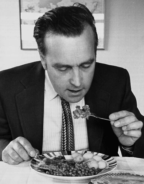 Journalist David Jack eating a meat lunch June 1975 1970s