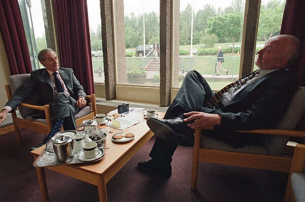 Journalist and writer, Harold Evans (left) talking to a journalist. 1st July 1998