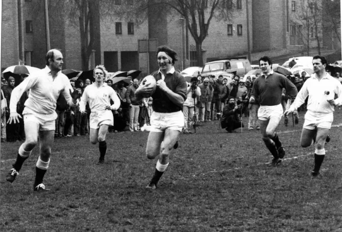 Framed Print : JPR Williams of the Old Wales team makes a break for the Old England Line during their Framed Print : JPR Williams of the Old Wales team makes a break for the Old England Line during their
