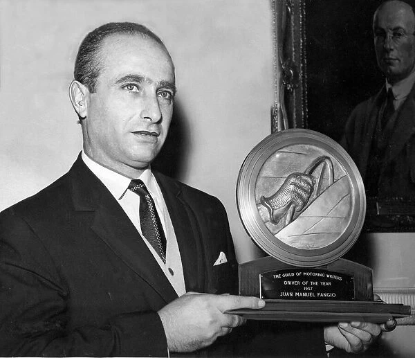 Juan Manuel Fangio received the Driver of the Year trophy from the Guild of Motoring