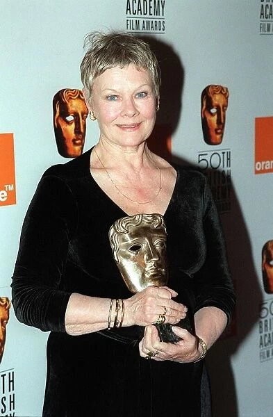 Judi Dench April 1998 pictured holding BAFTA Award