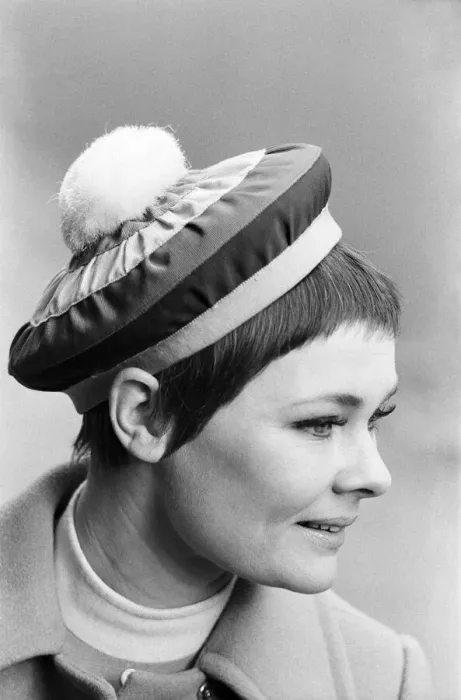 Framed Print : Judi Dench being photographed by the press wearing a Christian Dior beret called Framed Print : Judi Dench being photographed by the press wearing a Christian Dior beret called