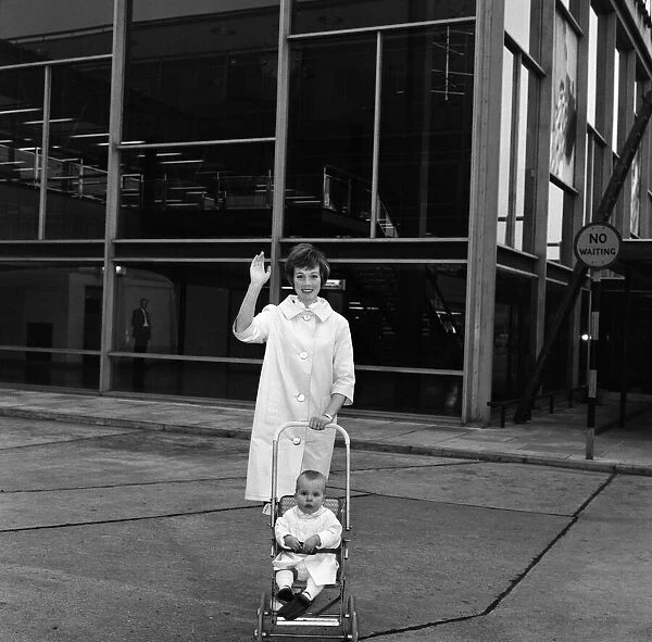 Julie Andrews at London Airport with her daughter Emma. They are flying to California