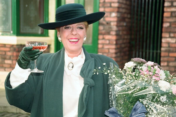 Julie Goodyear is pictured outside The Rovers Return on the set of Coronation Street