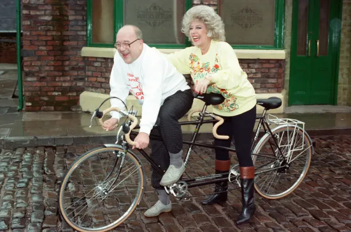 Framed Print : Julie Goodyear and Roy Barraclough pictured on a tandem bike on the set of Coronation Framed Print : Julie Goodyear and Roy Barraclough pictured on a tandem bike on the set of Coronation