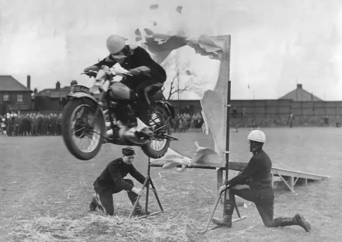 Framed Print : The jump through the paper hoop one of the many solo motorcycle tricks shown at Catterick Framed Print : The jump through the paper hoop one of the many solo motorcycle tricks shown at Catterick