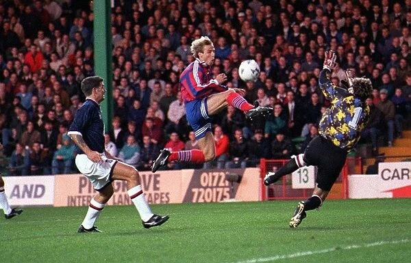 Jurgen Klinsmann scores for Bayern Munich against Raith Roversat during a UEFA Cup mnatch
