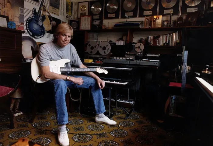 Framed Print : Justin Hayward lead singer of Moody Blues sits in his private recording studio at his