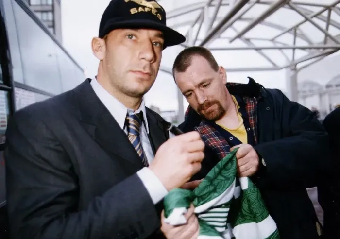 Framed Print : Juventus and Italy footballer Gianluca Vialli wearing a grey baseball cap and striped tie