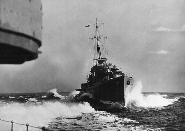 A K Class destroyer cutting across the wake of HMS Kelvin during a patrol of the Western
