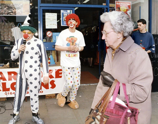 Karaoke clowns Peter Watson (right) and Stephen Brooks entertain shoppers in Stockton