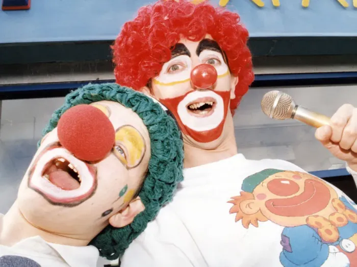 Framed Print : Karaoke clowns Peter Watson (right) and Stephen Brooks entertain shoppers in Stockton