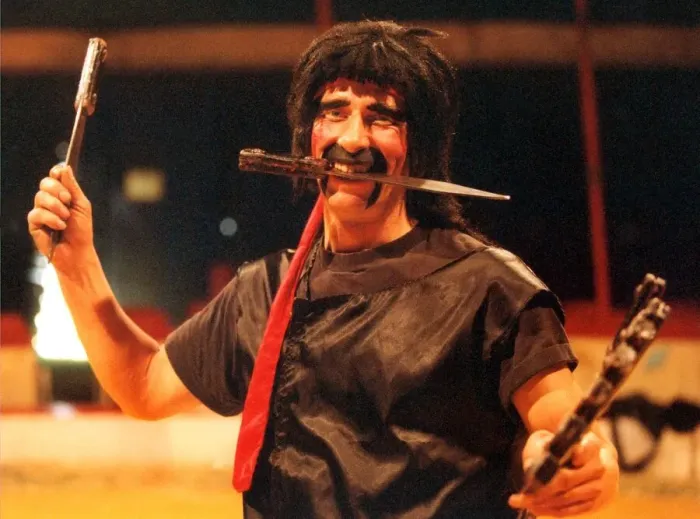 Framed Print : karl Orry of the Russian State Circus getting in some practice with his knives Framed Print : karl Orry of the Russian State Circus getting in some practice with his knives