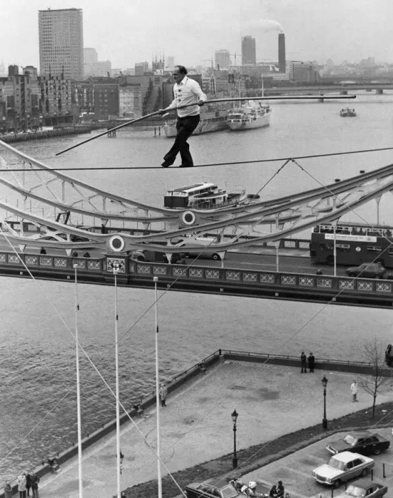 Framed Print : Karl Wallenda successfully walks 100 feet above the ground near Tower Bridge Framed Print : Karl Wallenda successfully walks 100 feet above the ground near Tower Bridge