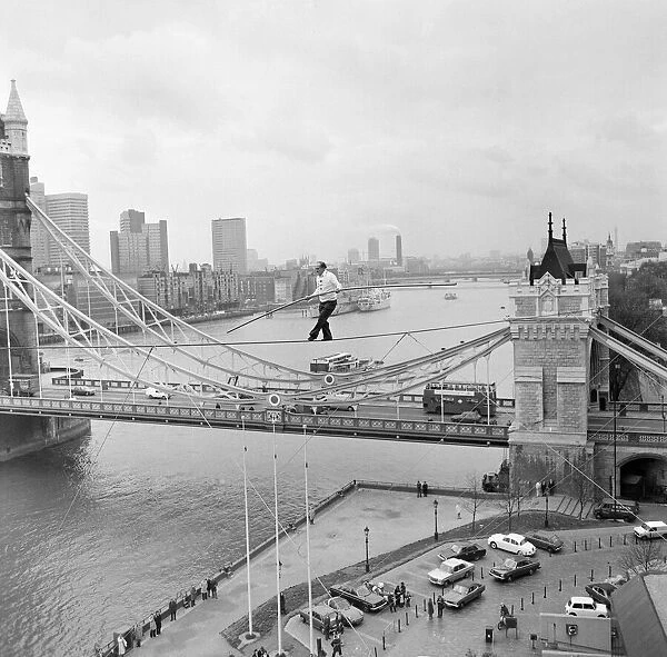 Karl Wallenda, Tightrope Walker, crosses 100ft above the ground, near Tower Bridge