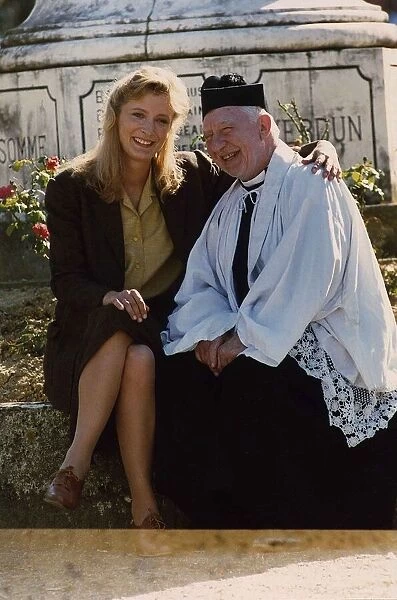 Kate Buffery sitting on wall with Priest January 1989 Dbase