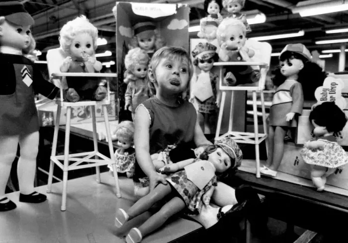 Framed Print : Kathleen Makeham with a selection of dolls at the end of the factory production line Framed Print : Kathleen Makeham with a selection of dolls at the end of the factory production line