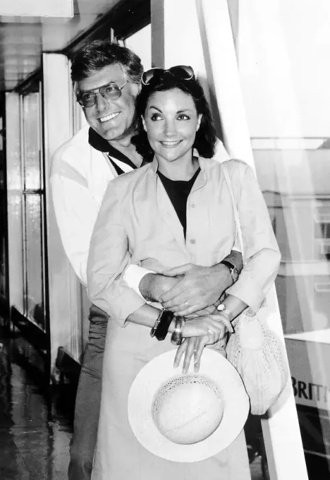 Framed Print : Kathryn Evans Singer and her husband Peter Purves TV Presenter at Heathrow airport after