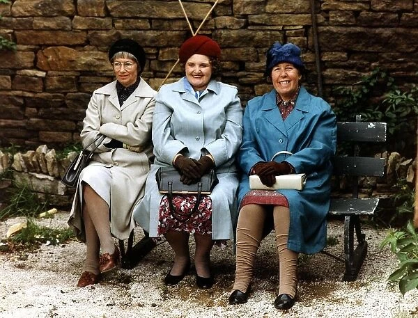 Kathy Staff actress stars in LAST OF THE SUMMER WINE plays NORA BATTY sits on park bench