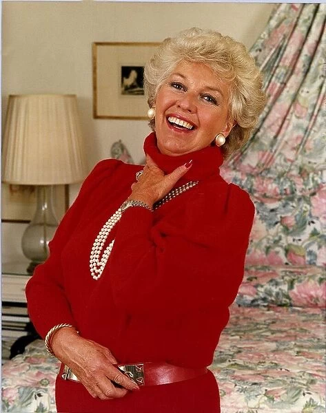 Katie Boyle columnist Relaxing at home wearing red top