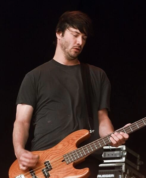 Keanu Reeves on stage June 1999 performing at the Glastonbury Festival with his