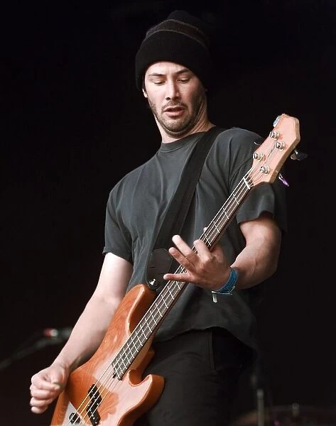 Keanu Reeves on stage June 1999 performing at the Glastonbury Festival with his