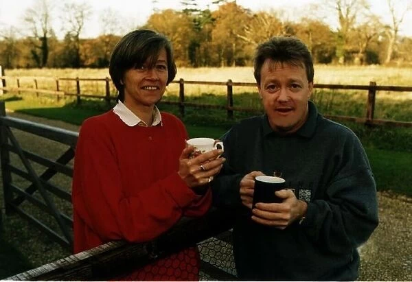 Keith Chegwin TV Presenter drinking tea outside in garden with woman name not known