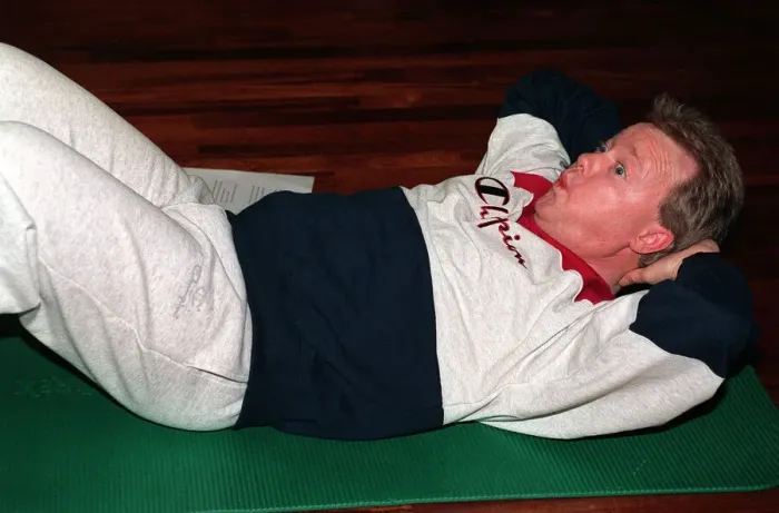 Framed Print : Keith Chegwin TV presenter at health farm January 1994 doing sit-ups Framed Print : Keith Chegwin TV presenter at health farm January 1994 doing sit-ups