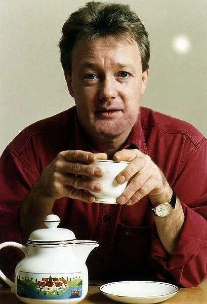 Keith Chegwin TV Presenter at home drinking tea