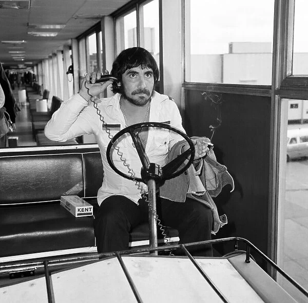 Keith Moon, drummer of The Who rock group, pictured arriving at Heathrow Airport from Los