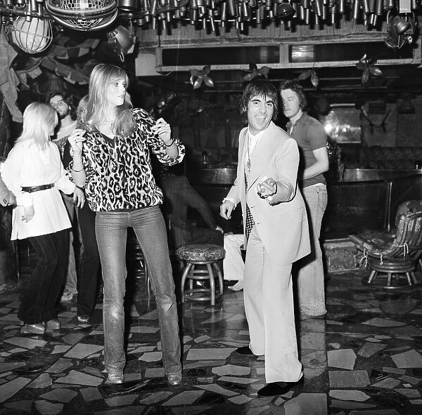 Keith Moon, drummer of The Who rock group, pictured with his girlfriend Annette dancing