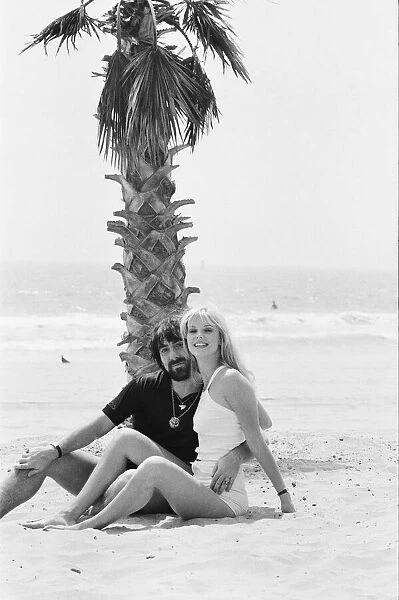 Keith Moon, drummer of The Who rock group with model Annette Lax in the resort of Malibu