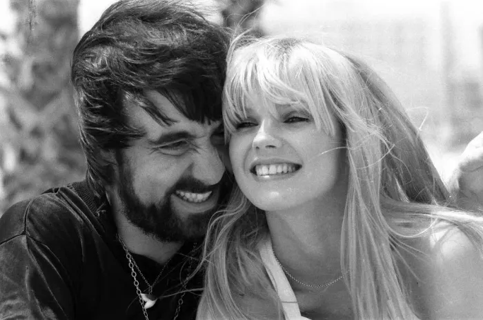 Framed Print : Keith Moon, drummer of The Who rock group with model Annette Lax in the resort of Malibu